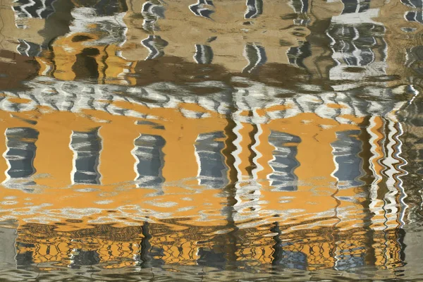 Reflections of houses in the water