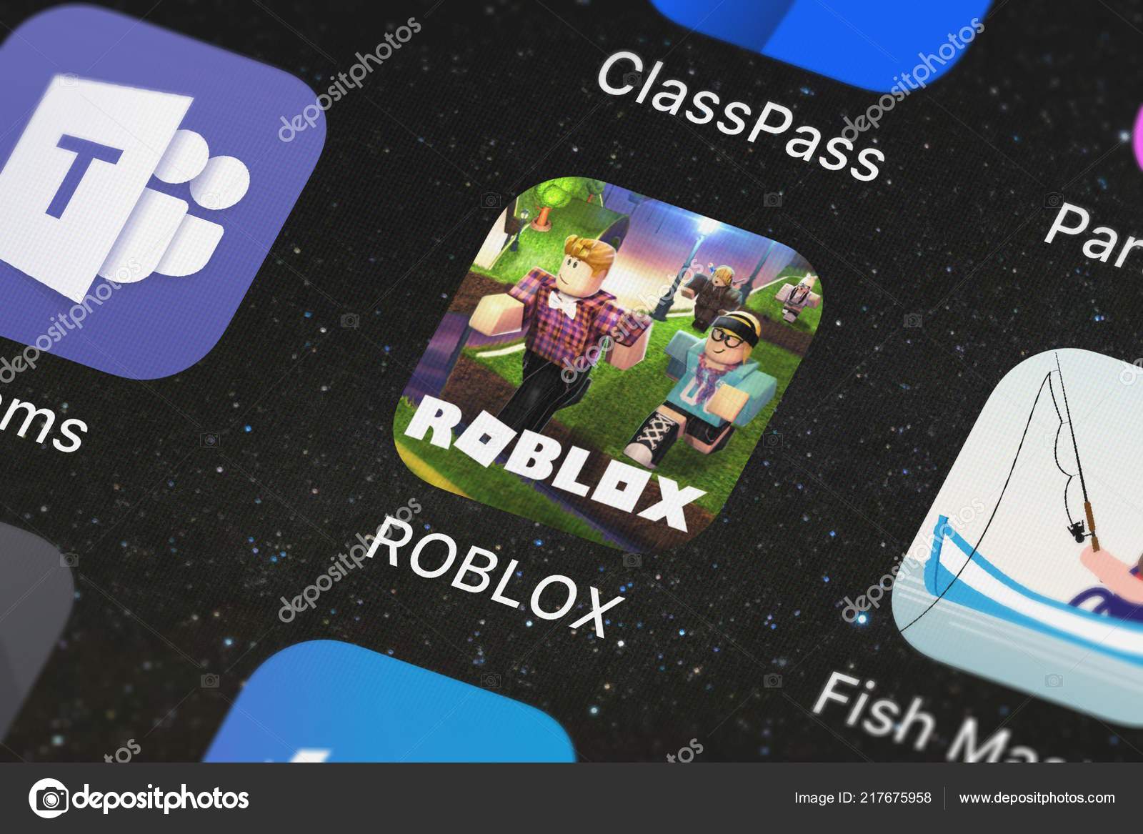 LONDON, UK - March 2021: Person holding a smartphone with Roblox game logo  Stock Photo