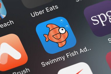 London, Büyük Britanya - 01 Ekim 2018: ekran görüntüsü yüzüş balık macera hareket eden app iphone üzerinde Creator fabrika Llc simgesinden.