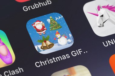 London, United Kingdom - October 02, 2018: Screenshot of the Christmas GIF Keyboard mobile app from Qiuxia Zeng icon on an iPhone. clipart