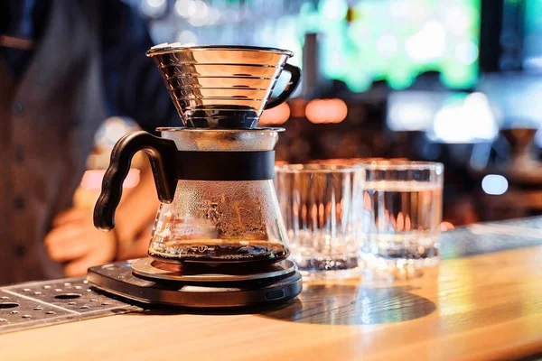 Close-up of the installation of a pourover with ground grain. An alternative method of brewing coffee. Delicious, black, rich coffee made from high quality premium Arabica.