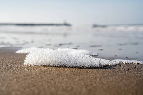 Schaum am Strand — Stockfoto