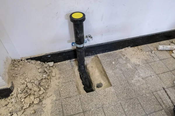 Black Polypropylene Drain Pipe Worked Floor — Stock Photo, Image