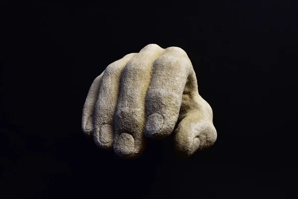 Stucco hand on black background