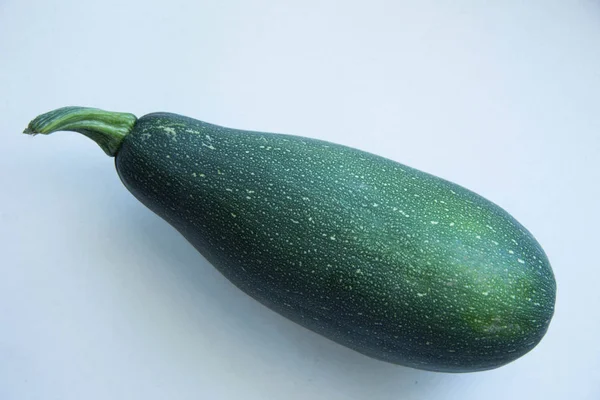 Green fresh zucchini on the white background — Stock Photo, Image