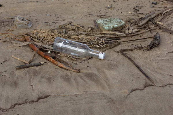 Pollution environment with garbage and bottle on sand beach