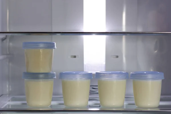 Breast milk storage stored in the back of refrigerator