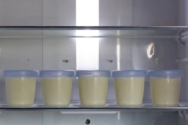 Breast milk storage stored in the back of refrigerator