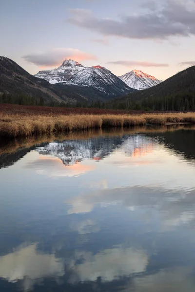 Uinta mountains reflecting in the Bear River, Utah, USA