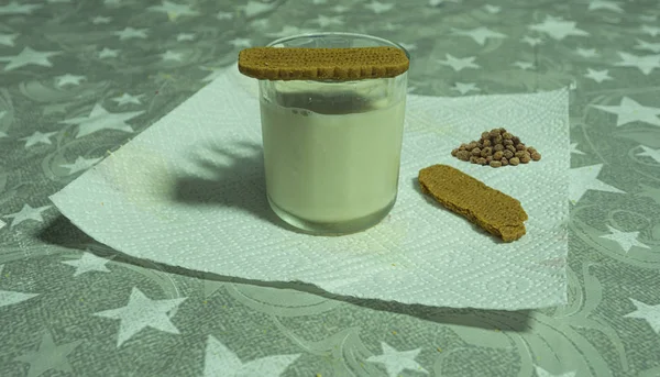 glass of tiger nut and cookie on table