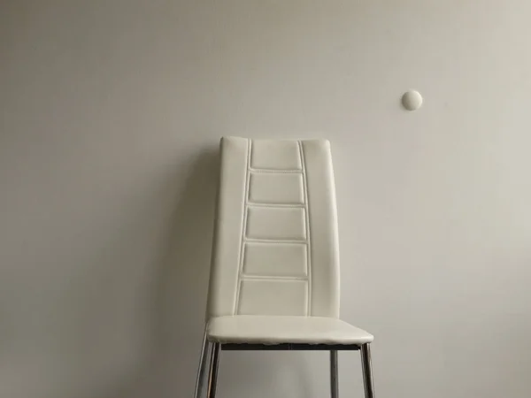 Minimalistic White Interior with one Chair