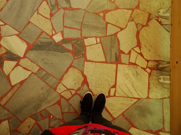 Feet on Old Floor Tiles