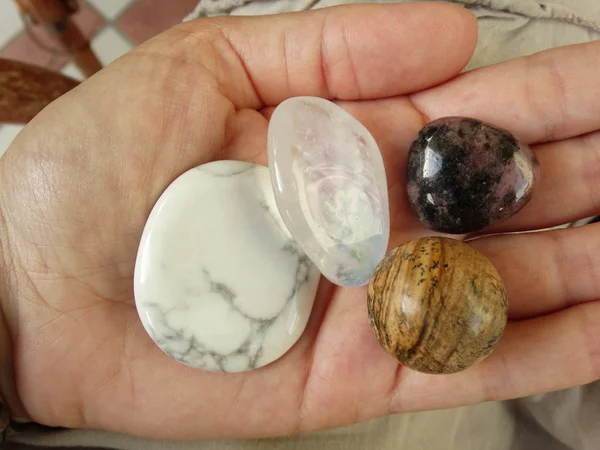 Polished Gem Stones in a Hand