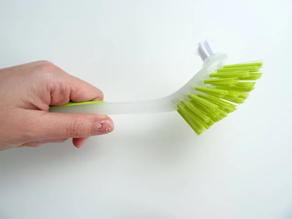 Hand Holding Green Cleaning Brush — Stock Photo, Image