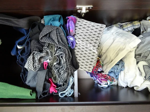 Wardrobe with Messy Woman Clothes