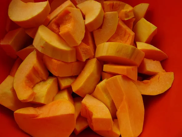Slices of Pumpkin in an Orange Bowl