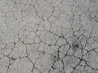 Çatlak asfalt doku arkaplanı 