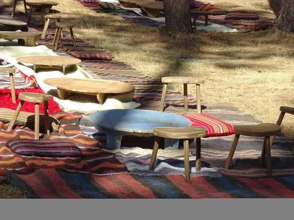 Native Bulgarian Rugs and Tables on the Ground