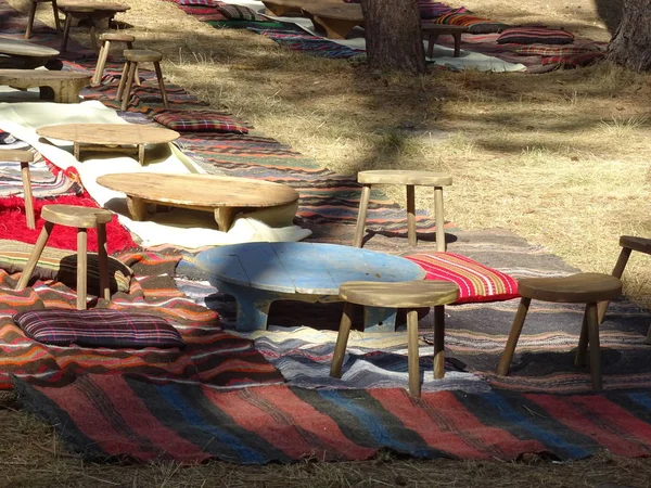 Native Bulgarian Rugs and Tables on the Ground
