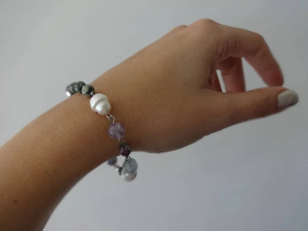 Woman Hand with a Delicate Gemstone Bracelet