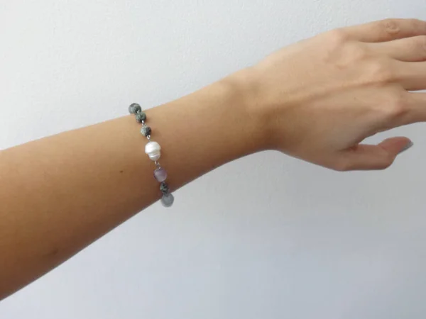Woman Hand with a Delicate Gemstone Bracelet
