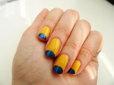 Blue and Yellow Nail Polish Art clipart