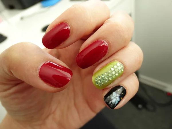 Red, Green and Black Nail Art with Stones and a Flower