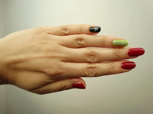 Red, Green and Black Nail Art with Stones and a Flower