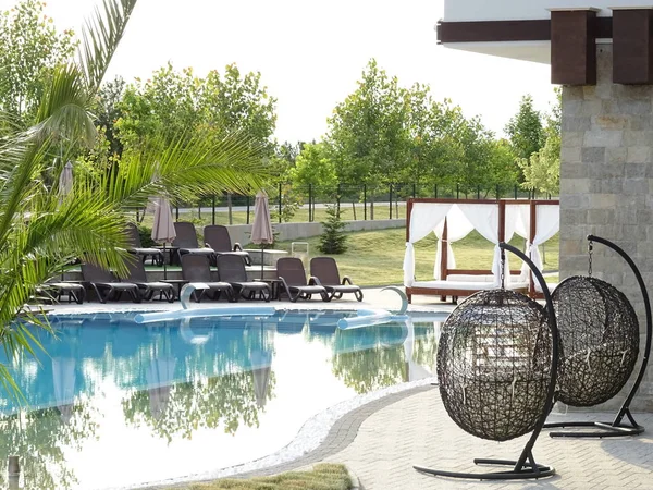 Hanging Hammock Chairs near Swimming Pool