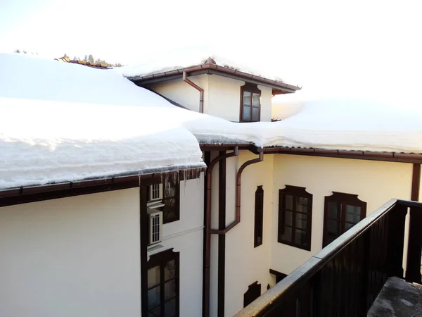 Bulgarian Houses with Snow on the Roofs