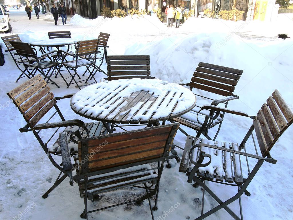 Chairs and Table Coverd with Snow