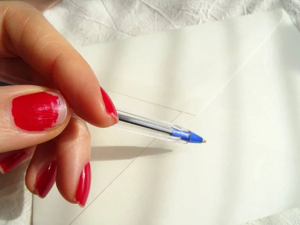 Female Hand Red Nailpolish Writing Letter — Stock Photo, Image