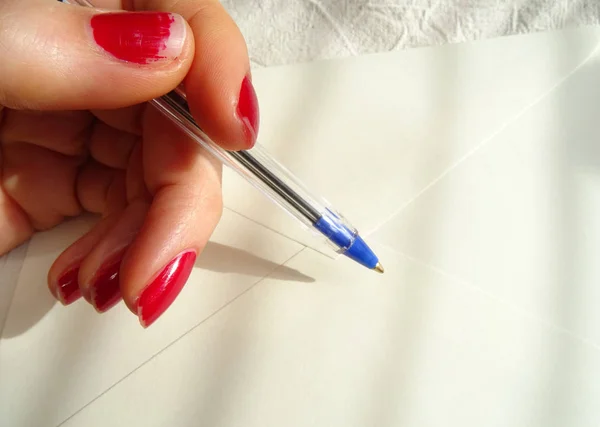 Female Hand Red Nailpolish Writing Letter — Stock Photo, Image