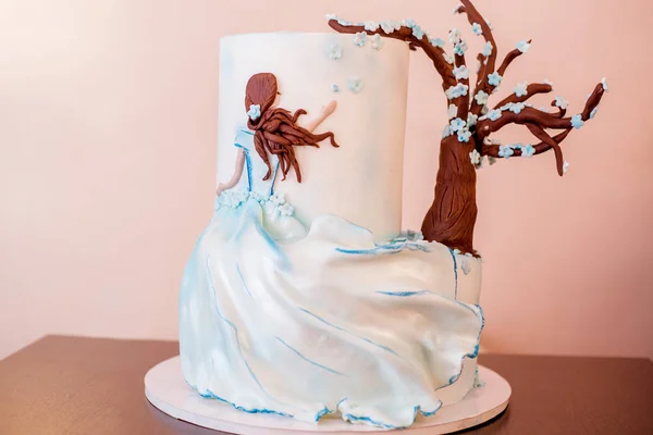 Nice cake designed with girl and tree