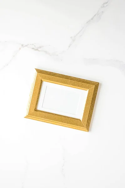 golden photo frame on marble, flatlay mockup - decor and mockup flatlay styled concept