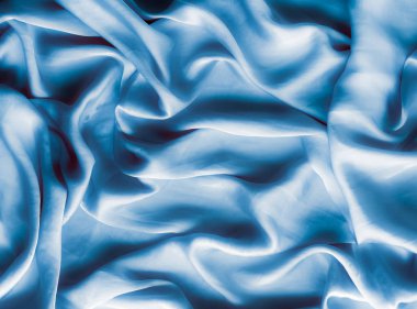 Mavi yumuşak ipek dalgalar, flatlay - şık kumaş dokular, arka ve modern pastel renklerle kavramı. Lüks dokunuş hissediyorum