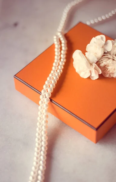 Present box and flowers for her - Mother\'s day ideas, happy giving and holiday inspiration concept. The perfect gift for mom