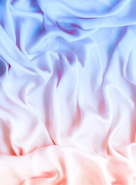 Neon yumuşak ipek dalgalar, flatlay - şık kumaş dokular, arka ve modern pastel renklerle kavramı. Zamansız lüks hissetmeye