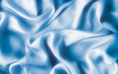 Mavi yumuşak ipek dalgalar, flatlay - şık kumaş dokular, arka ve modern pastel renklerle kavramı. Lüks dokunuş hissediyorum