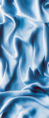 Mavi yumuşak ipek dalgalar, flatlay - şık kumaş dokular, arka ve modern pastel renklerle kavramı. Lüks dokunuş hissediyorum