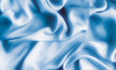 Mavi yumuşak ipek dalgalar, flatlay - şık kumaş dokular, arka ve modern pastel renklerle kavramı. Lüks dokunuş hissediyorum