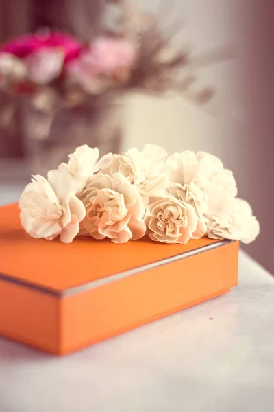 Present box and flowers for her - Mother's day ideas, happy giving and holiday inspiration concept. The perfect gift for mom