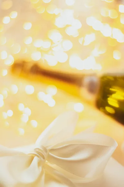 The bottle of champagne and holiday gift box — Stock Photo, Image