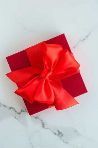 Luxury red holiday gifts on marble — Stock Photo, Image