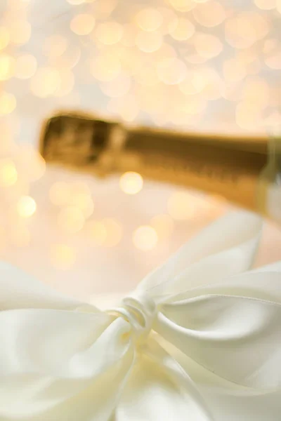 The bottle of champagne and holiday gift box — Stock Photo, Image