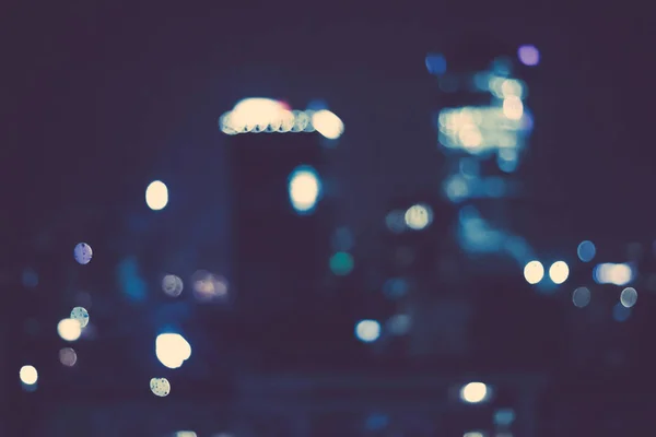 Grandes luces de la ciudad metropolitana en la noche, fondo borroso —  Fotos de Stock