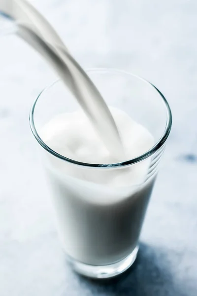 World Milk Day, pouring into glass on marble table