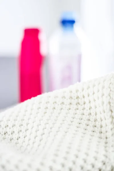 Warm knitted clothes and liquid laundry detergent