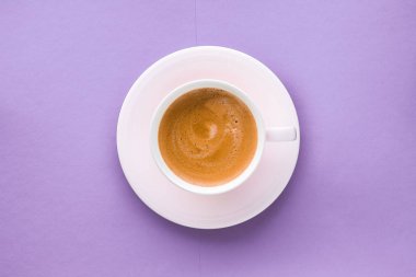 Coffee cup on purple background, top view flatlay clipart
