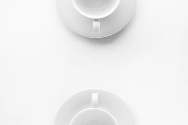 Töm kopp och tefat utkast på vit bakgrund, flatlay — Stockfoto